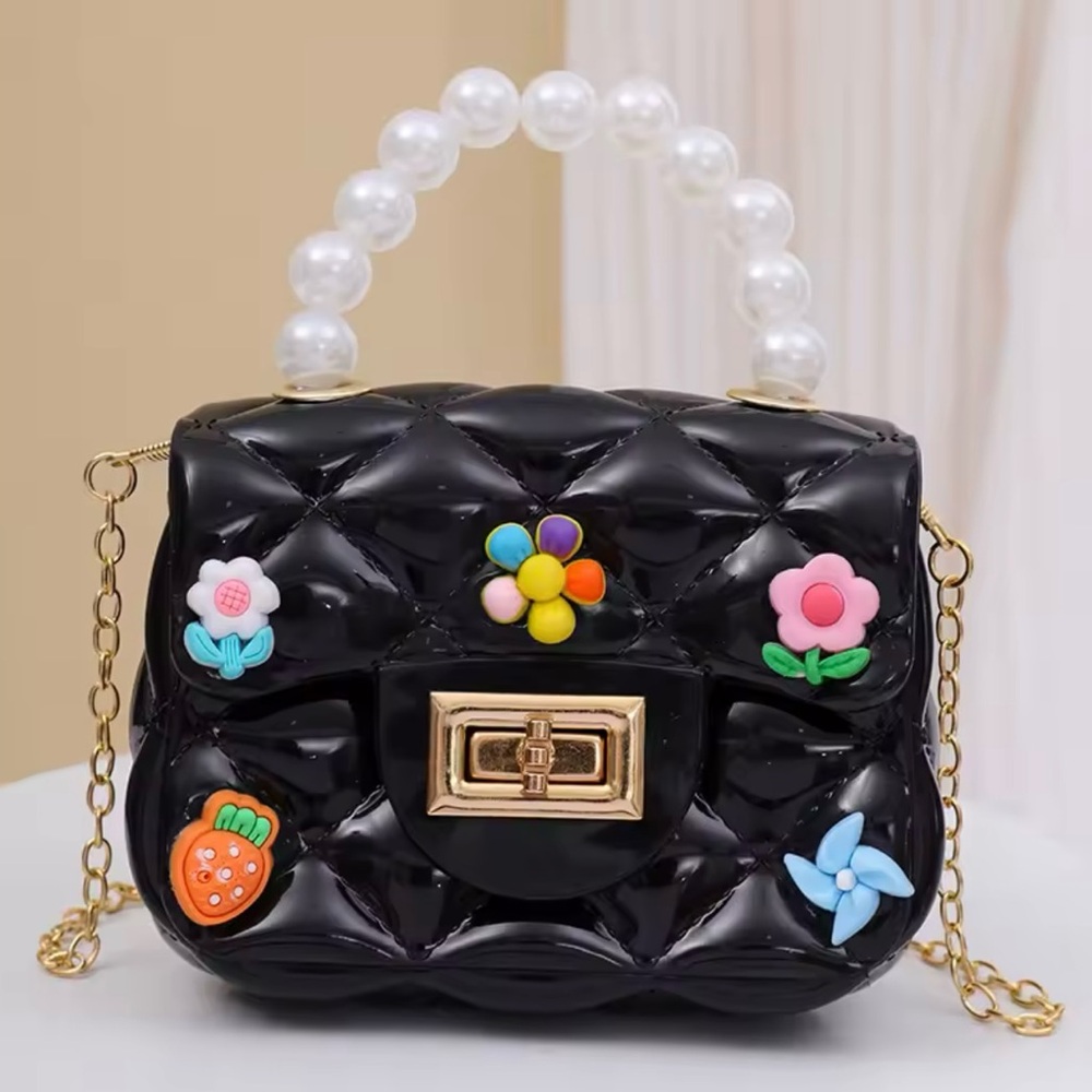 Black Quilted Handbag with Pearl Handle and a Gold Plated Shoulder Strap.